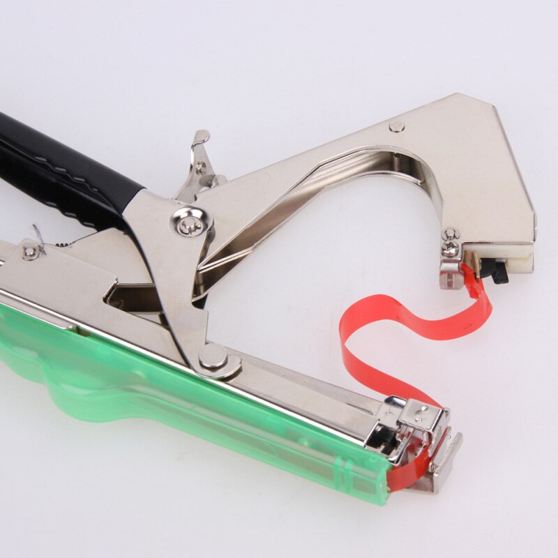 Stainless tape head feeding red tape through the jaws