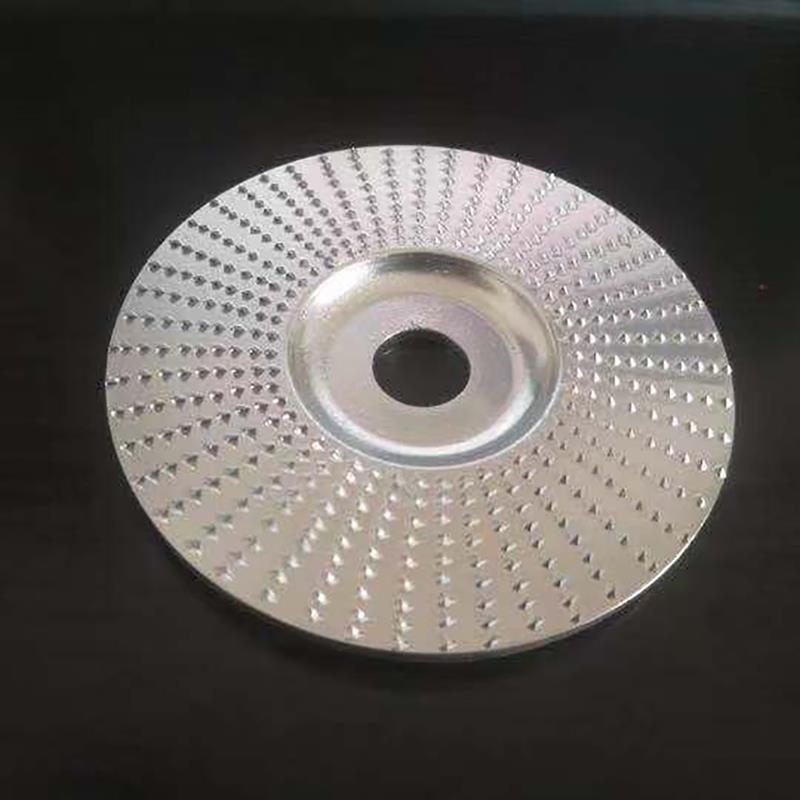 Top-down view of silver wood grinding disc showing tooth pattern and bore