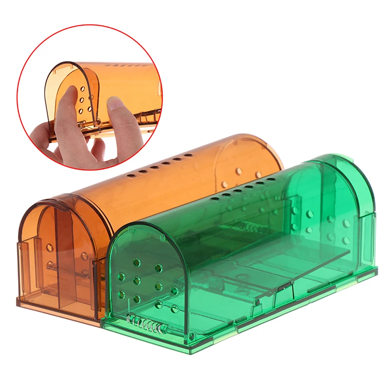 Fingers pressing the spring-loaded door on an amber mouse cage