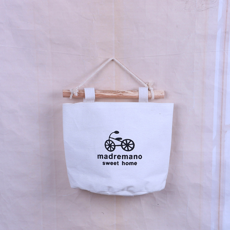 Canvas wall bag with bicycle print showing rounded pocket opening up close