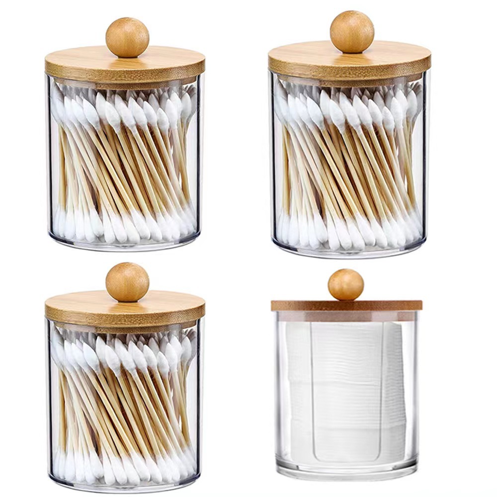 Matching clear jars with bamboo knob lids in a neat row