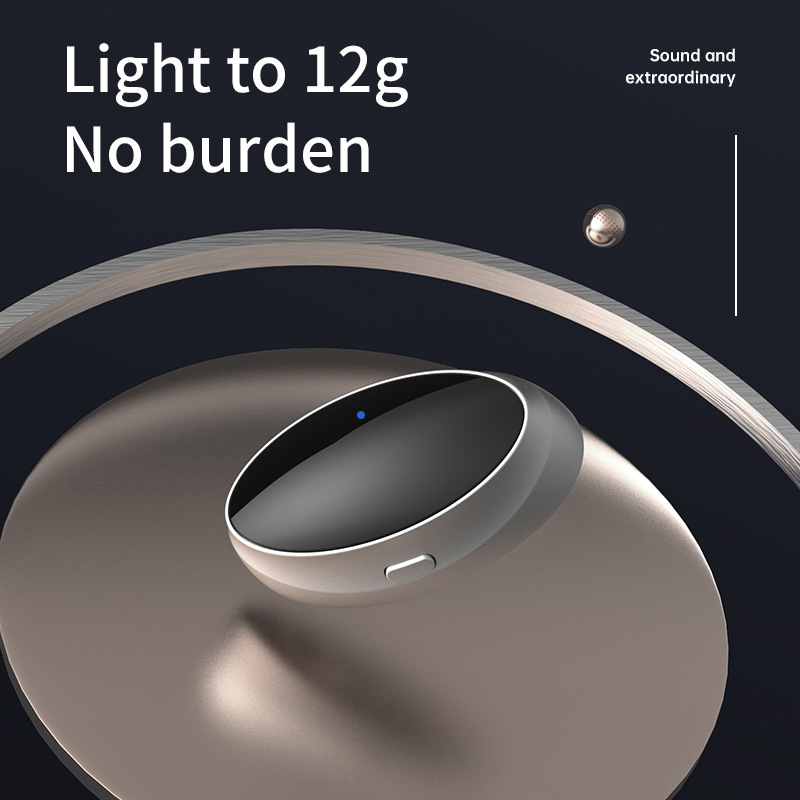 Silver snoring device on a metal disc beside the words light to 12g