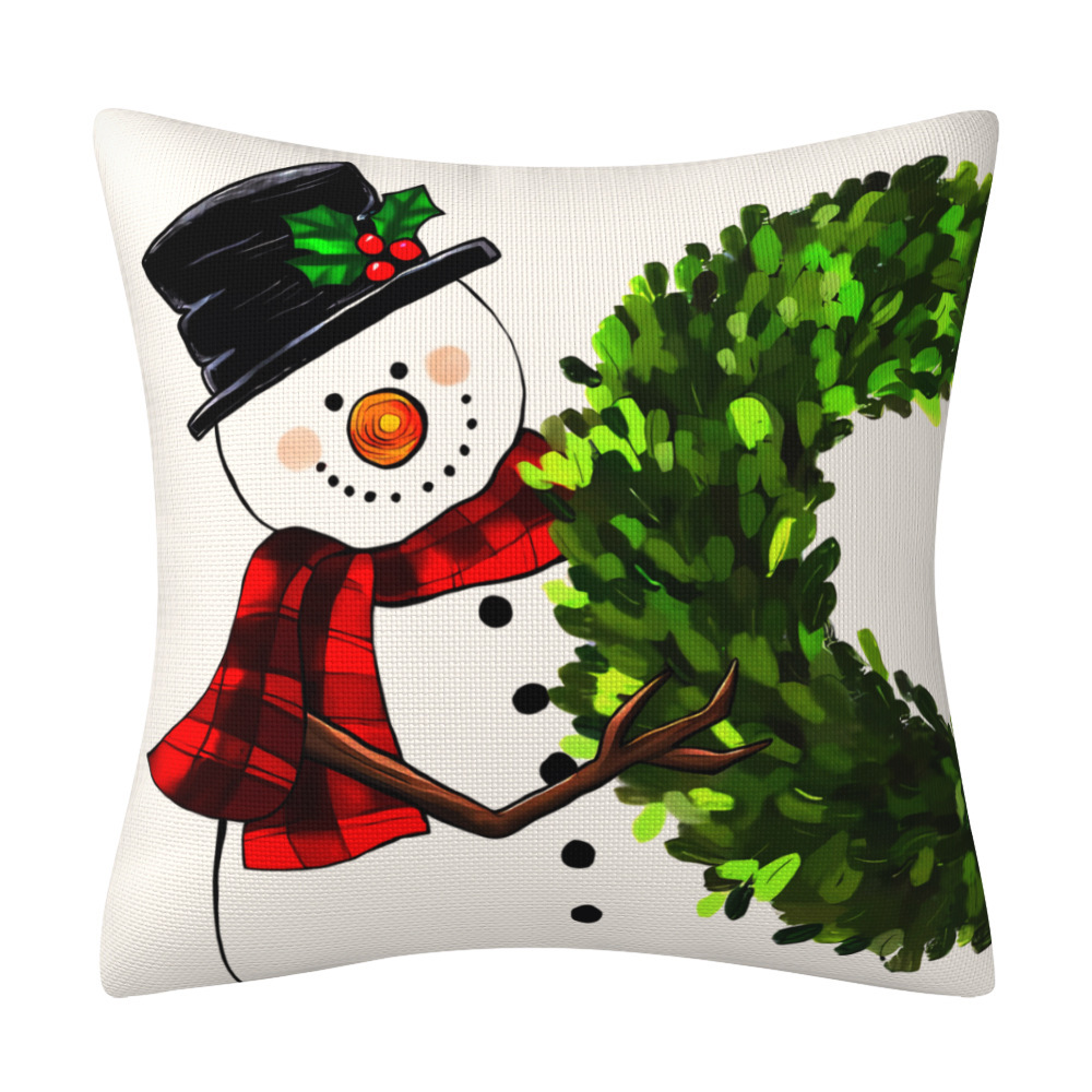 Cream cushion cover with a snowman, plaid scarf and boxwood wreath