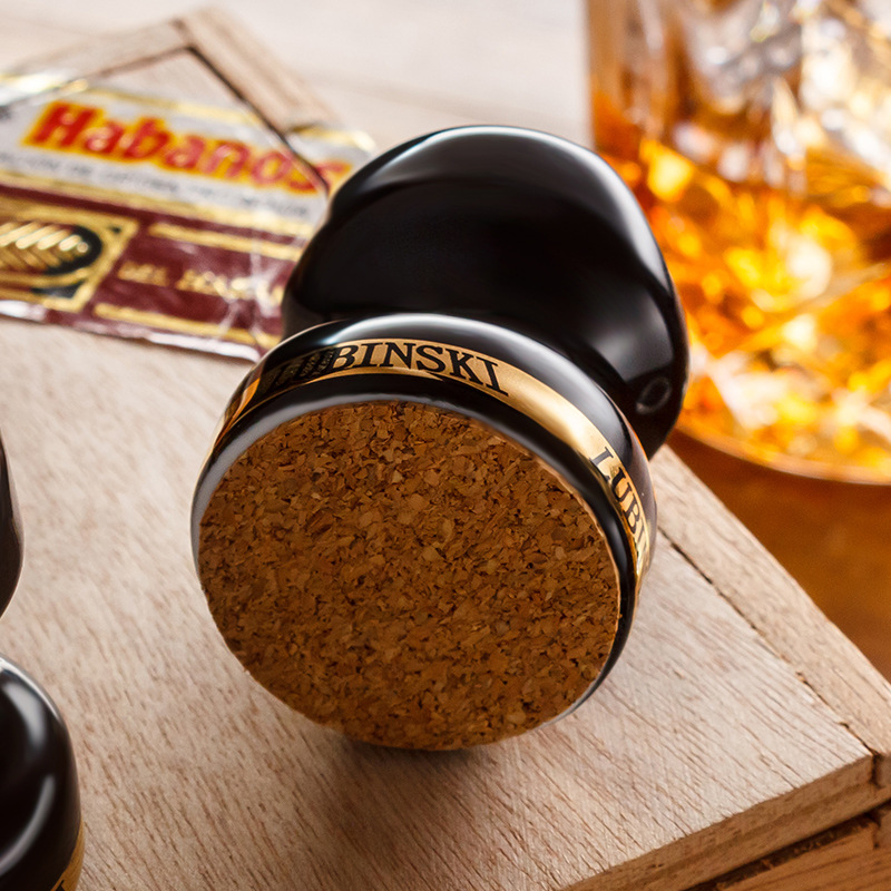 Close-up of cork base ring on a black ceramic cigar holder
