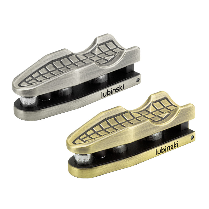 Two antique metal cigar openers in silver and brass finishes