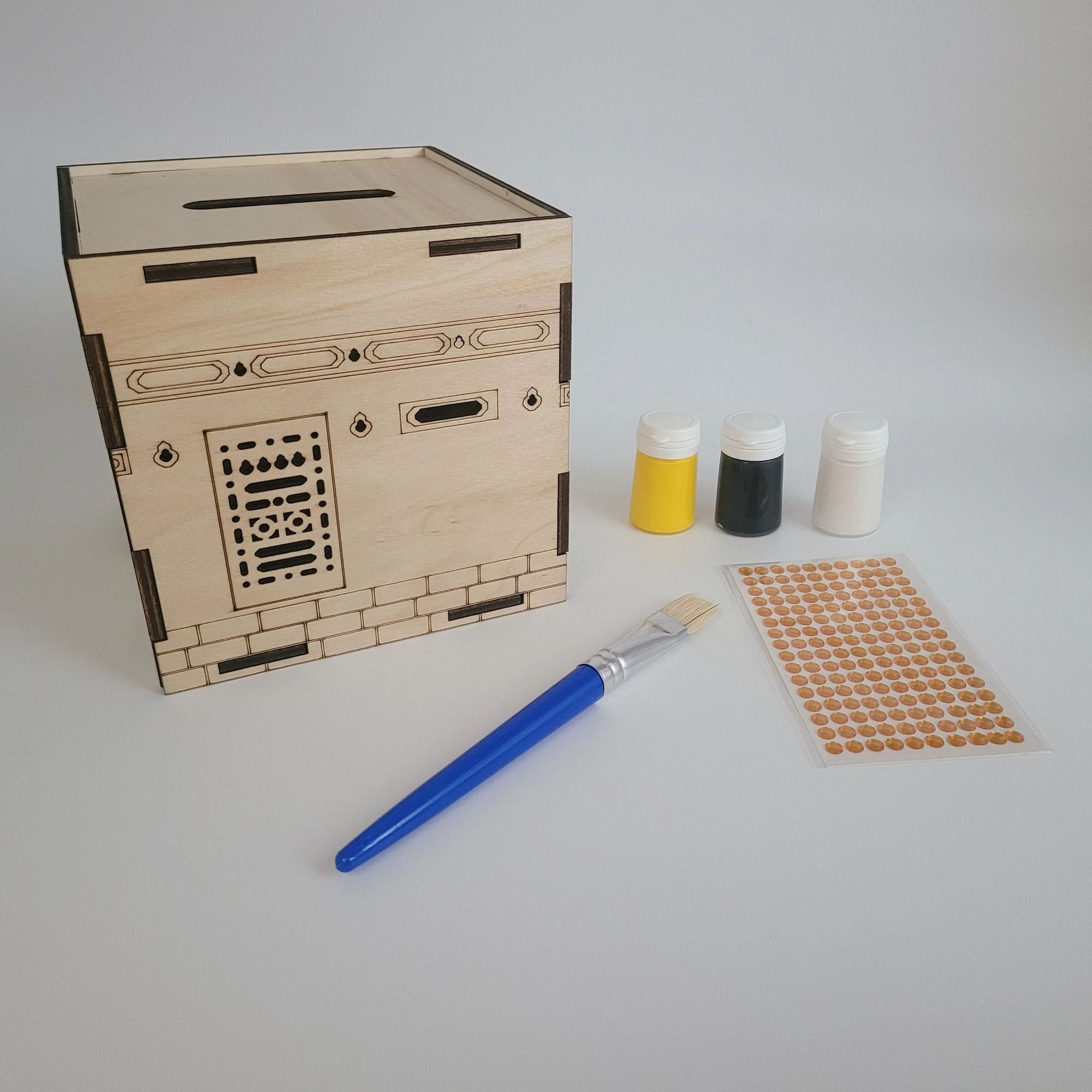 Craft kit with wooden Kaaba box, three paint pots, brush and gold stickers
