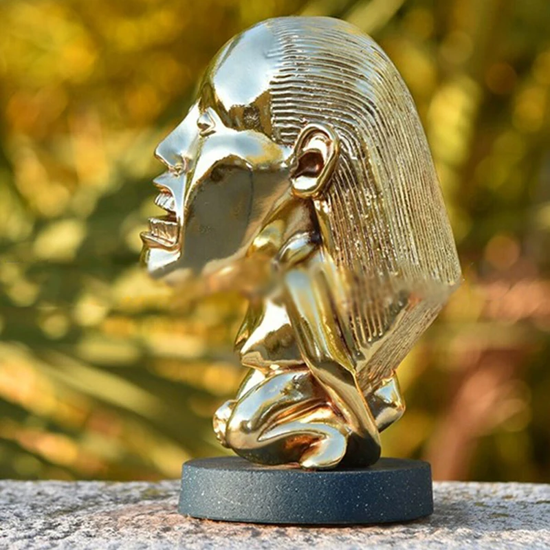 Gold idol statue shown as a movie prop for display and cosplay use