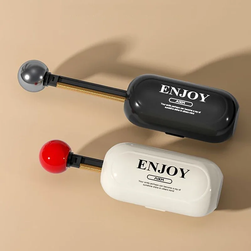 Retractable brush arm extended beside the capsule body on a beige surface