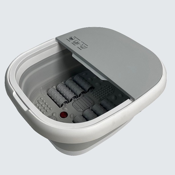 Open foot tub showing massage rollers and nodes on the base