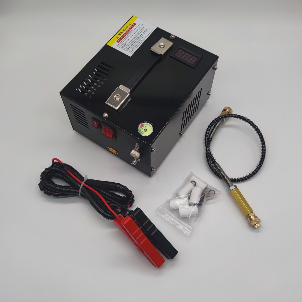 Orange and black portable air pump shown with its power leads