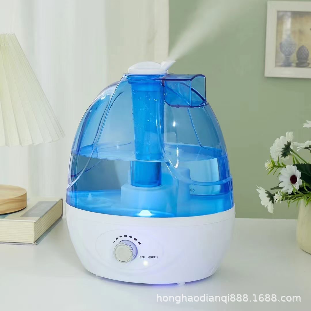Blue humidifier releasing mist in a living room with ambient light