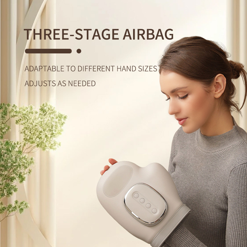Woman in a grey sweater relaxing with the hand massager on
