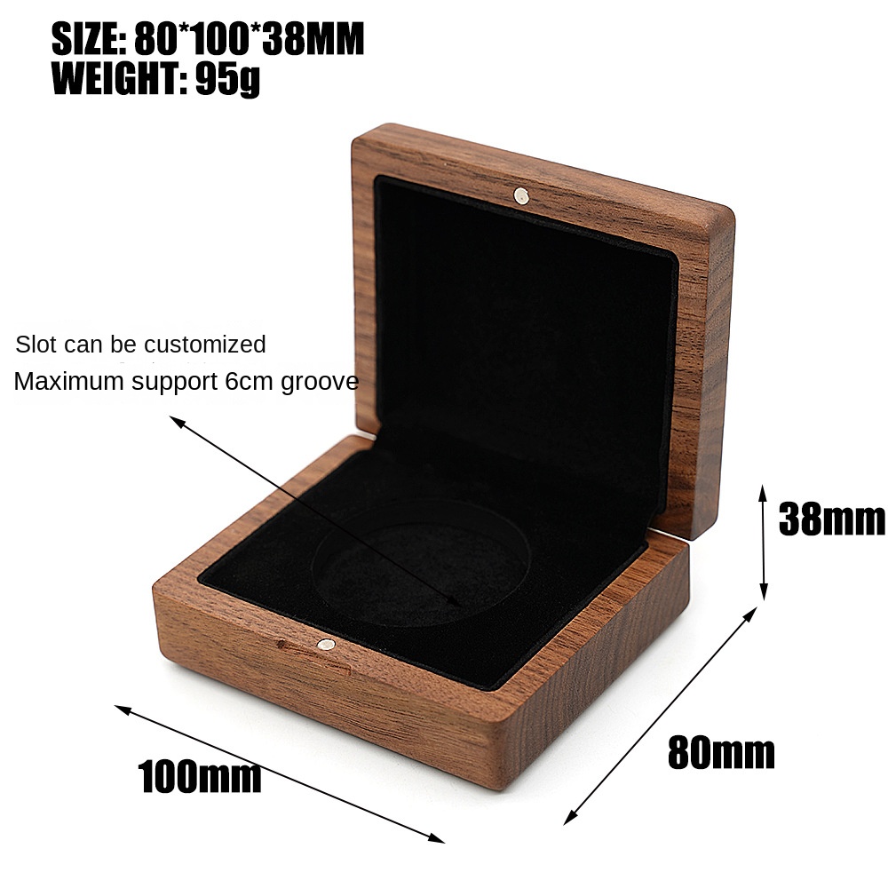 Open walnut box with black velvet coin well and printed size and weight specs