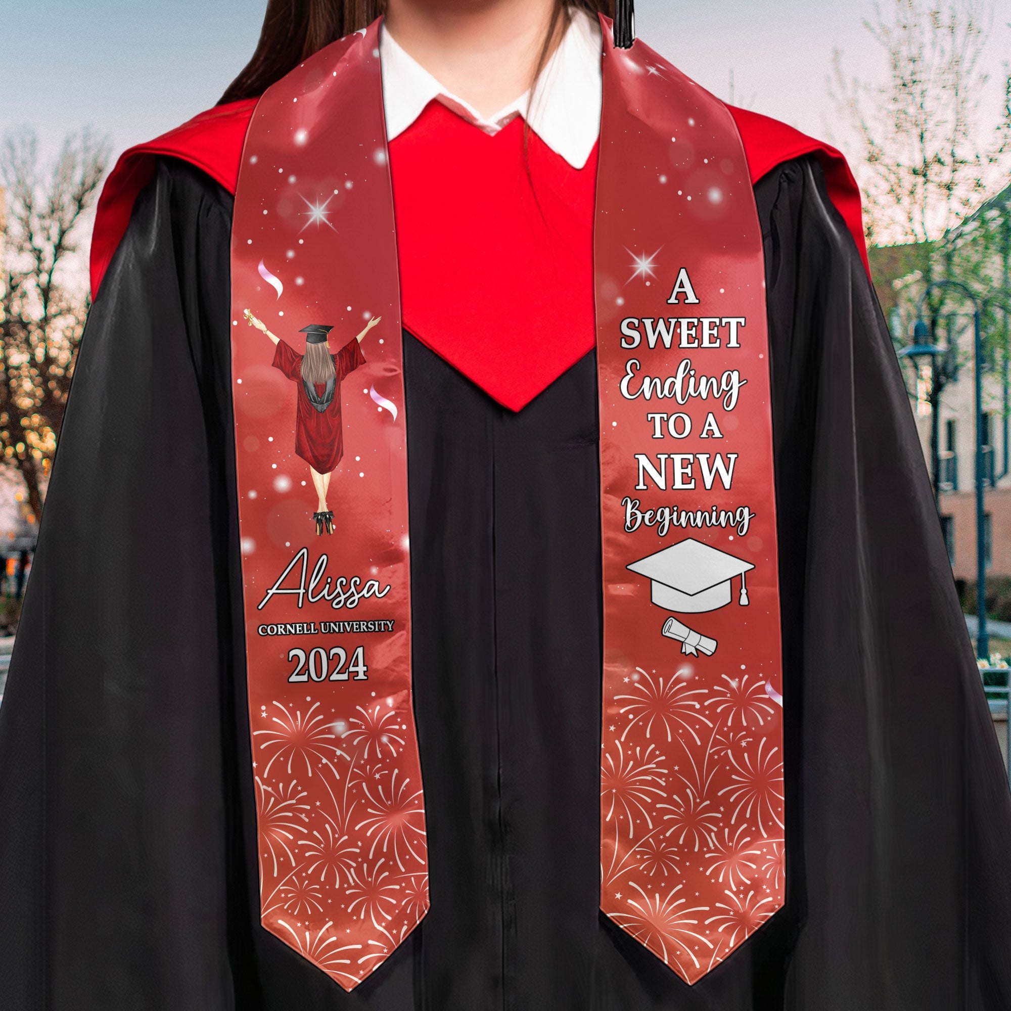 Red graduation stole with the text "A Sweet Ending To A New Beginning" on a black graduation gown, satin/polyester blend